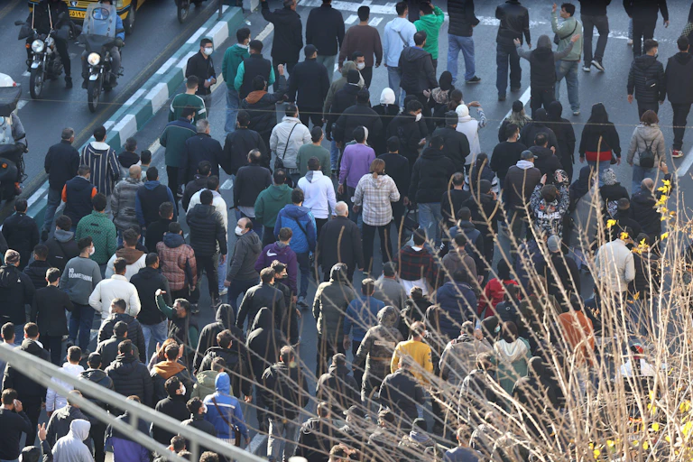Protesters march through Tehran.