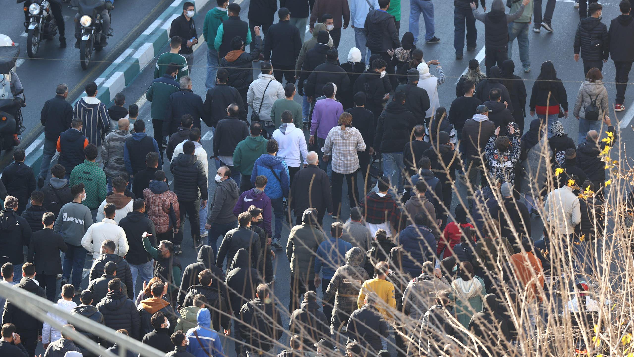 Protesters march through Tehran.