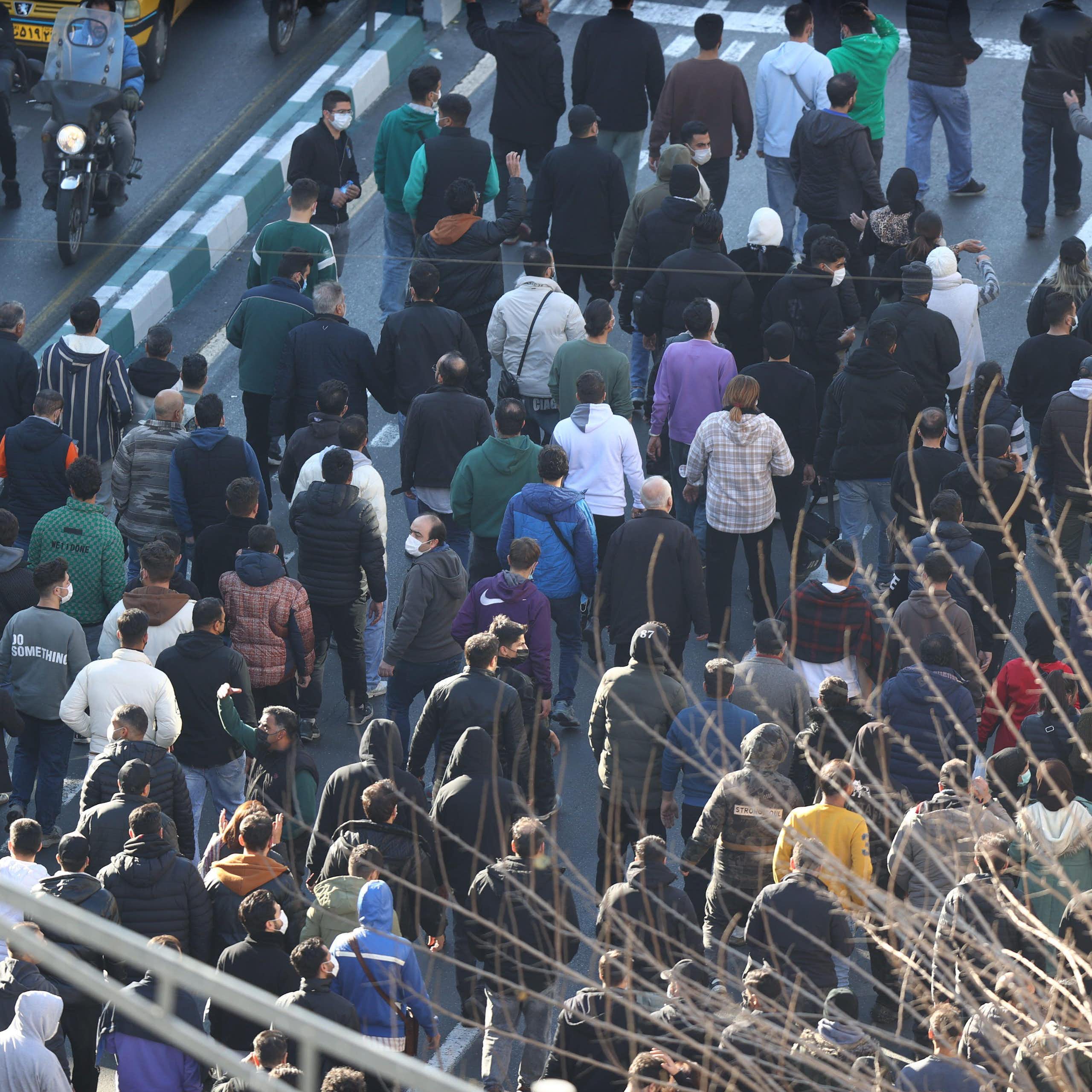 Protesters march through Tehran.