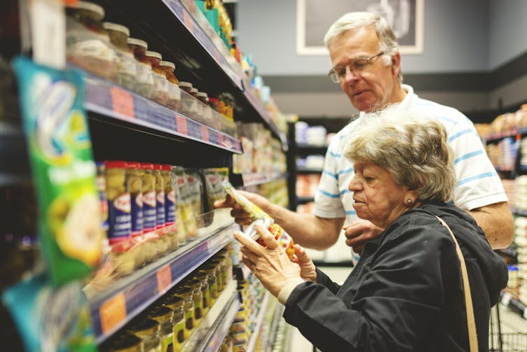 Older couple shopping in a supermarket
