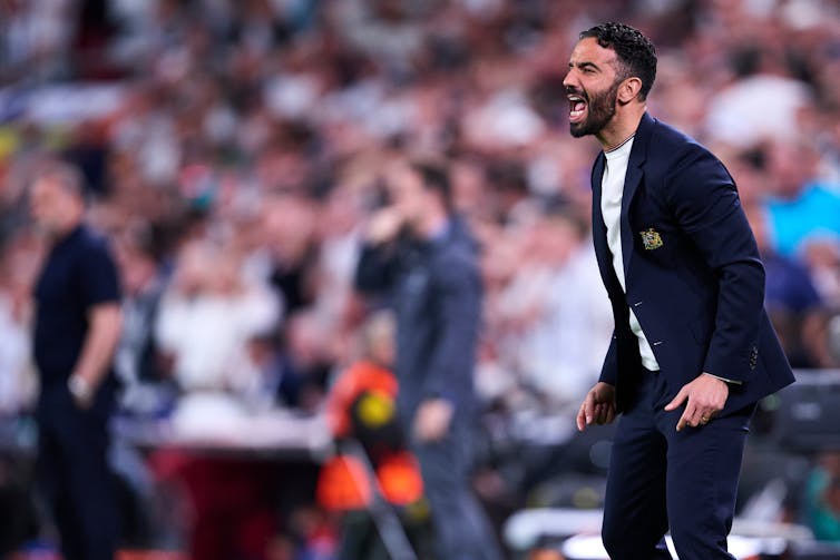 former manchester united manager ruben amorim shouting during a match.