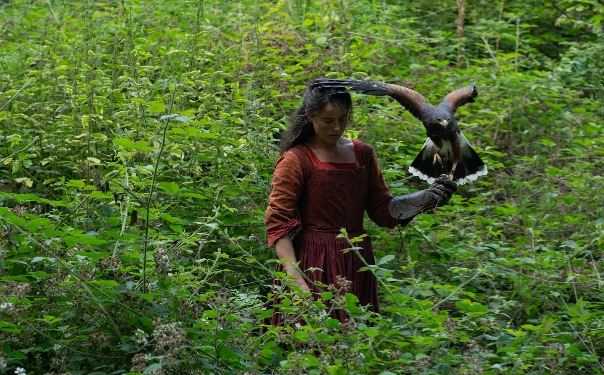 Jessie Buckley holding a hawk