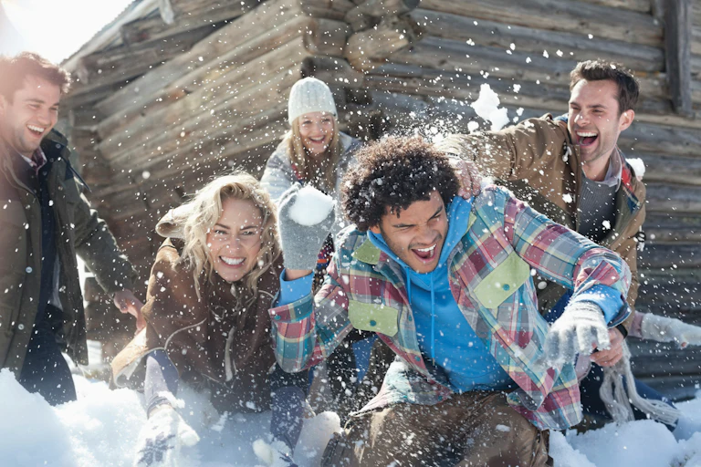 A group of friends having fun in the snow.
