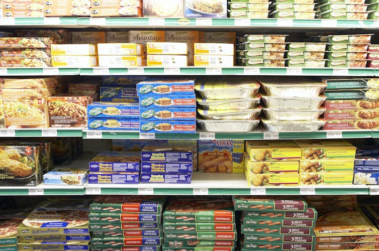 Grocery store shelves laden with packaged foods