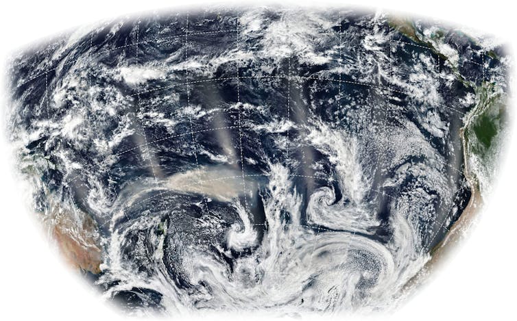 Satellite image showing smoke plumes across the Pacific ocean.