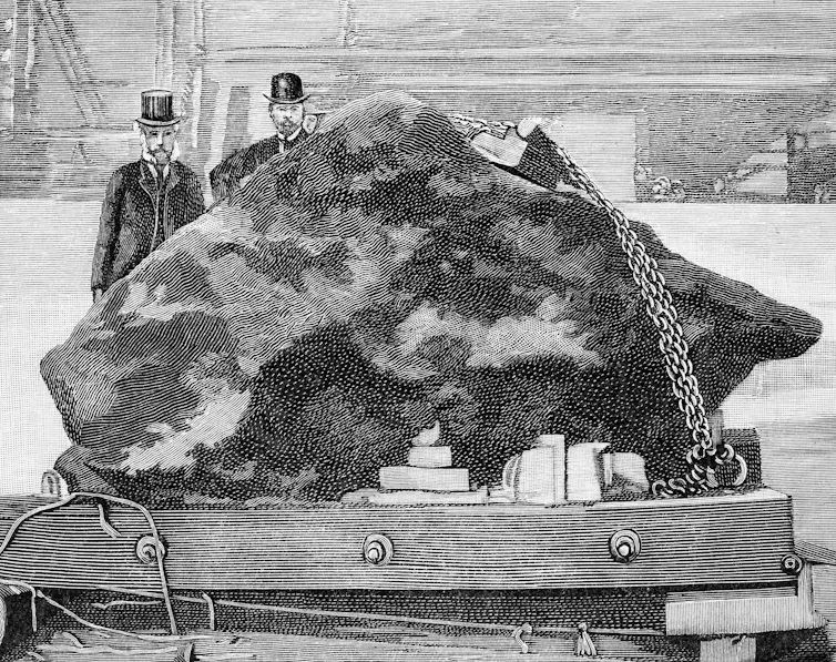 Engraving of men looking at large boulder