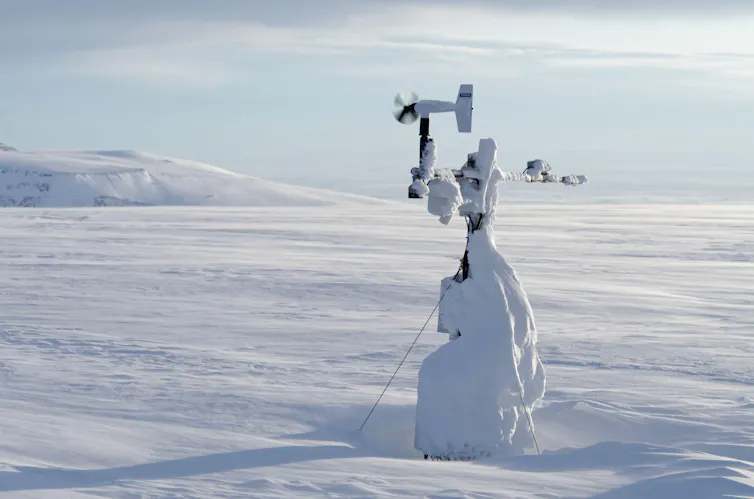 weather station covered in snow and ice