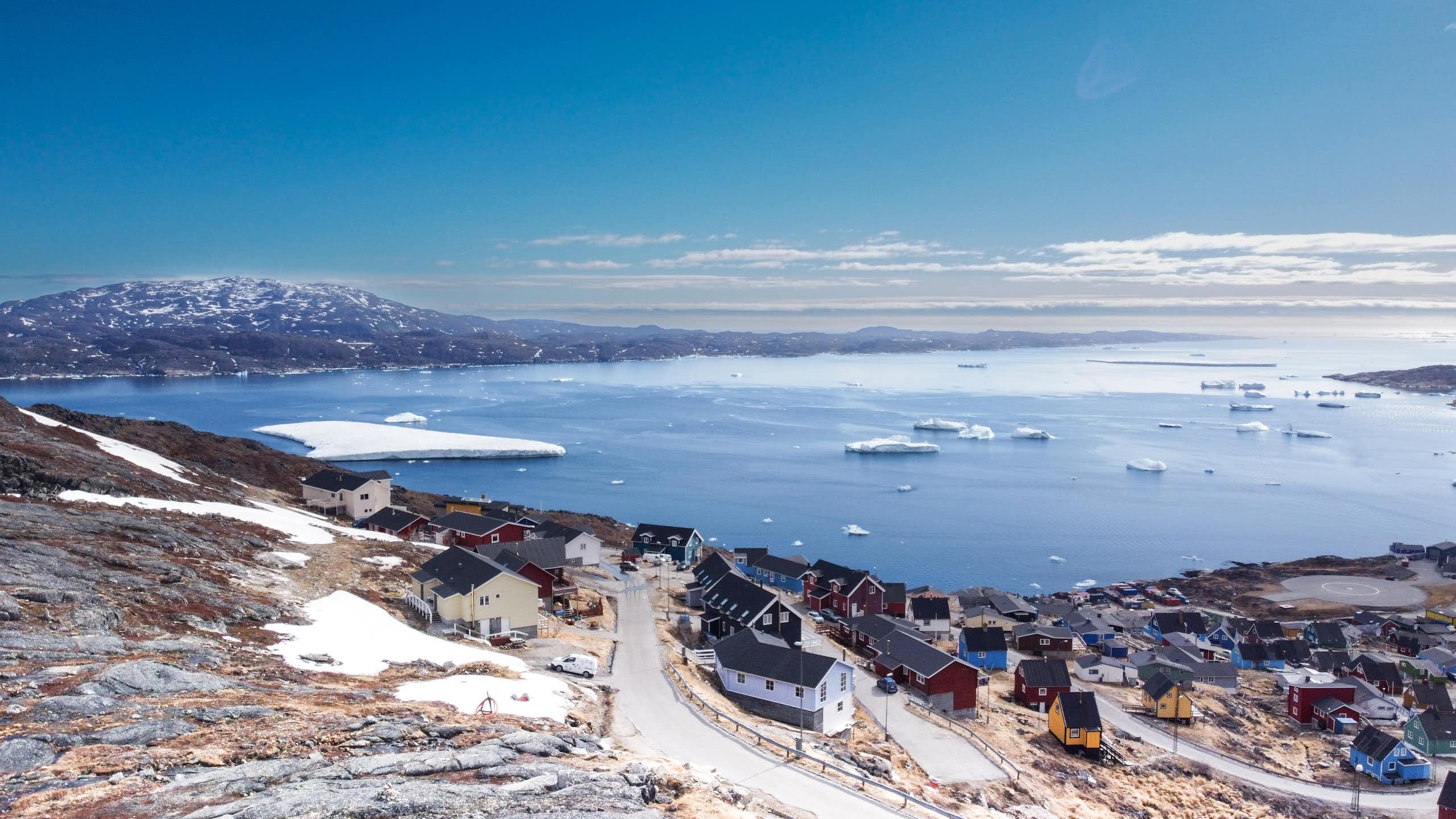 Aerial view small beautiful village over snow in Greenland