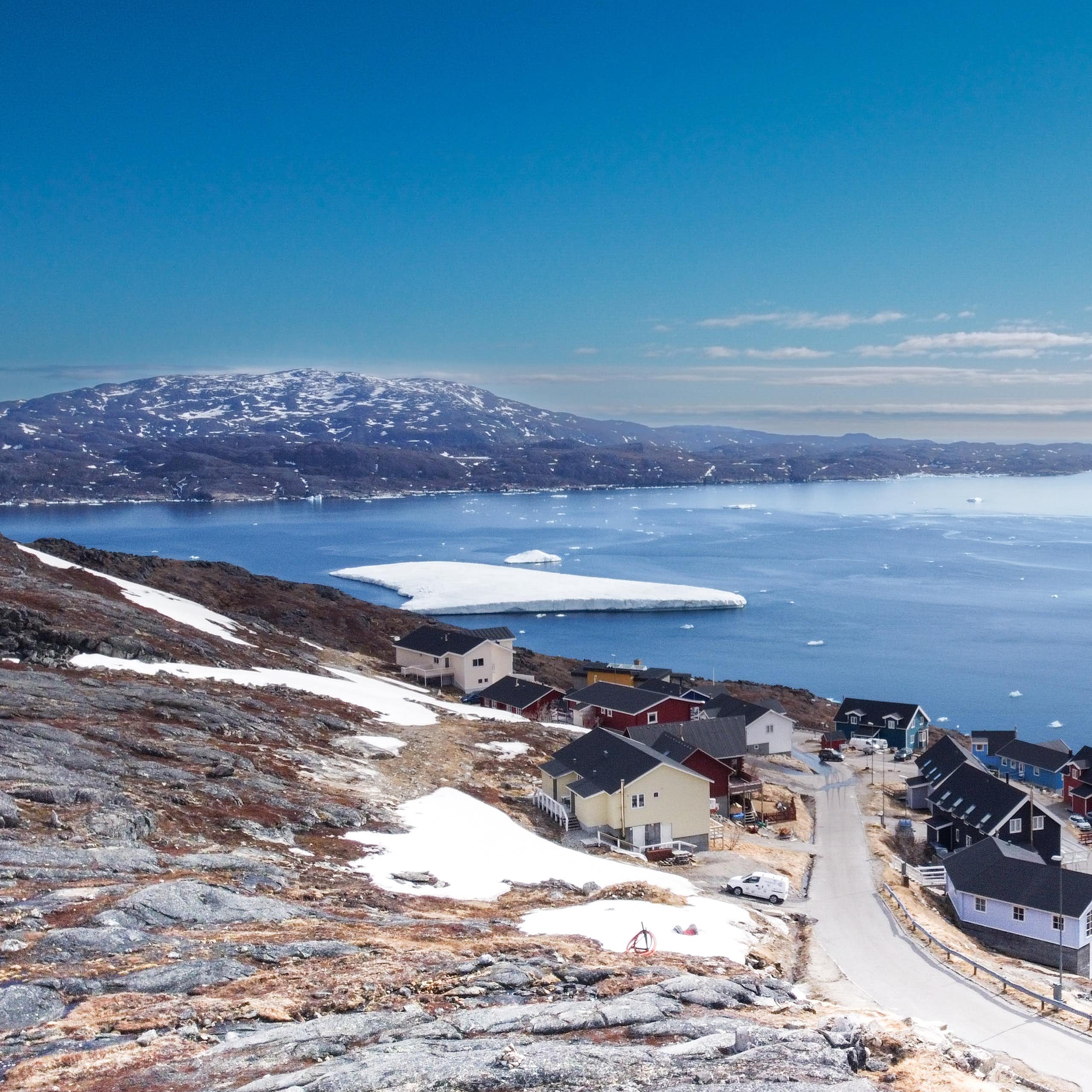 Aerial view small beautiful village over snow in Greenland