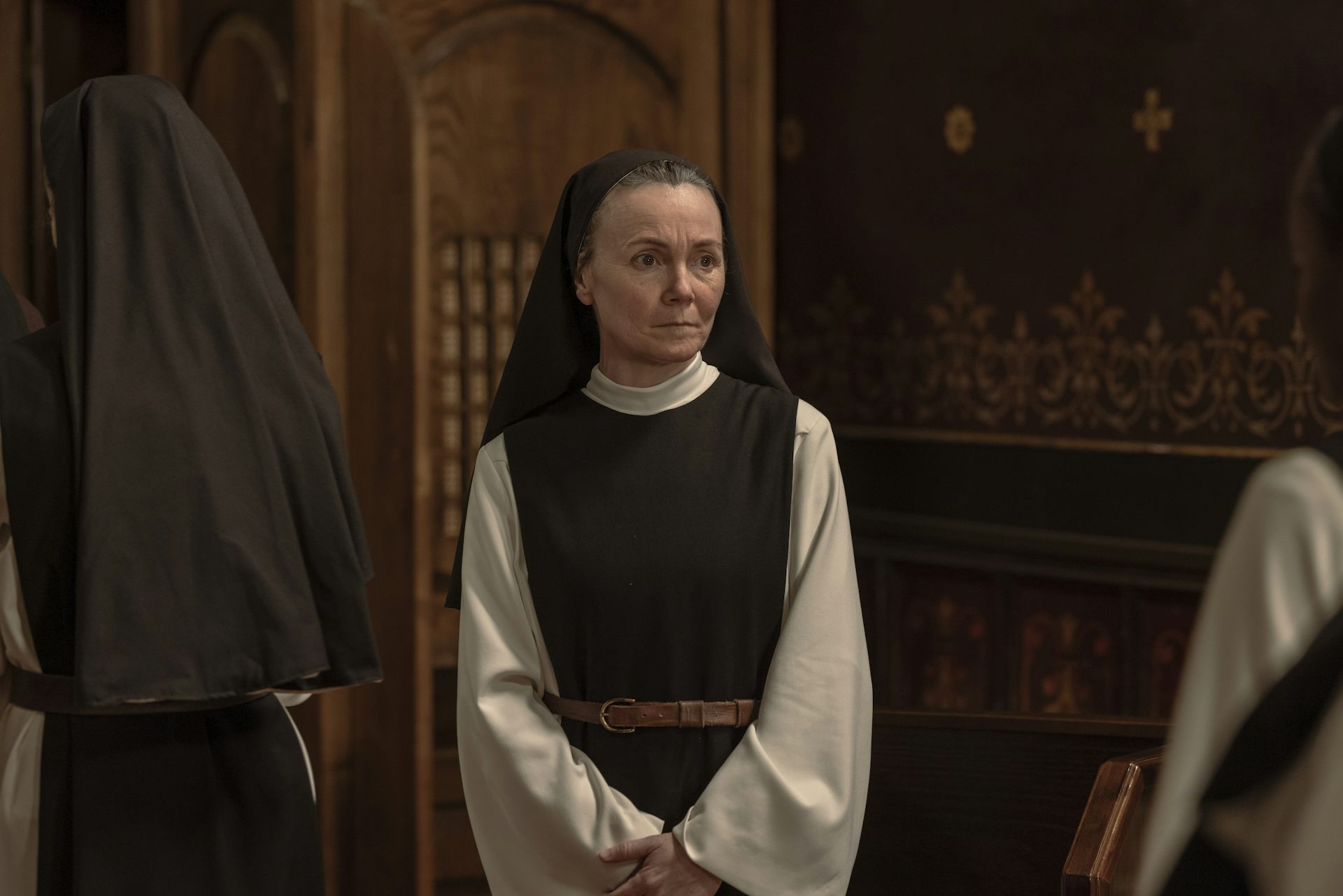 A picture of a nun in a church.