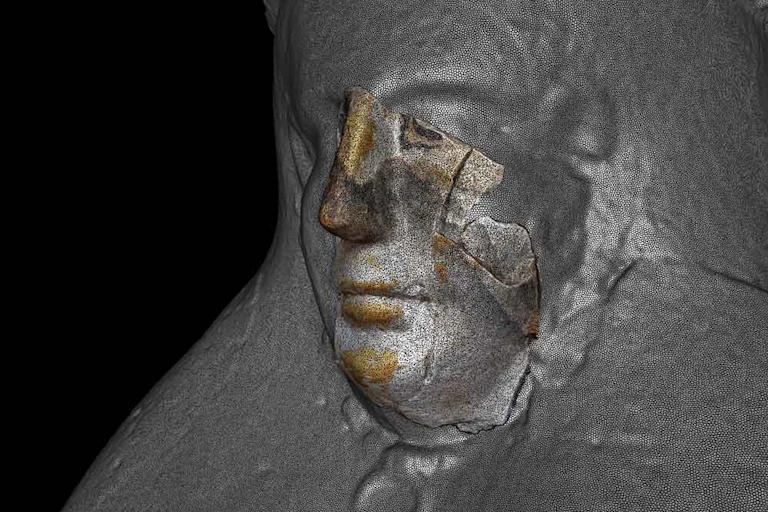 details of a face are overlaid on a larger complete image of a bust
