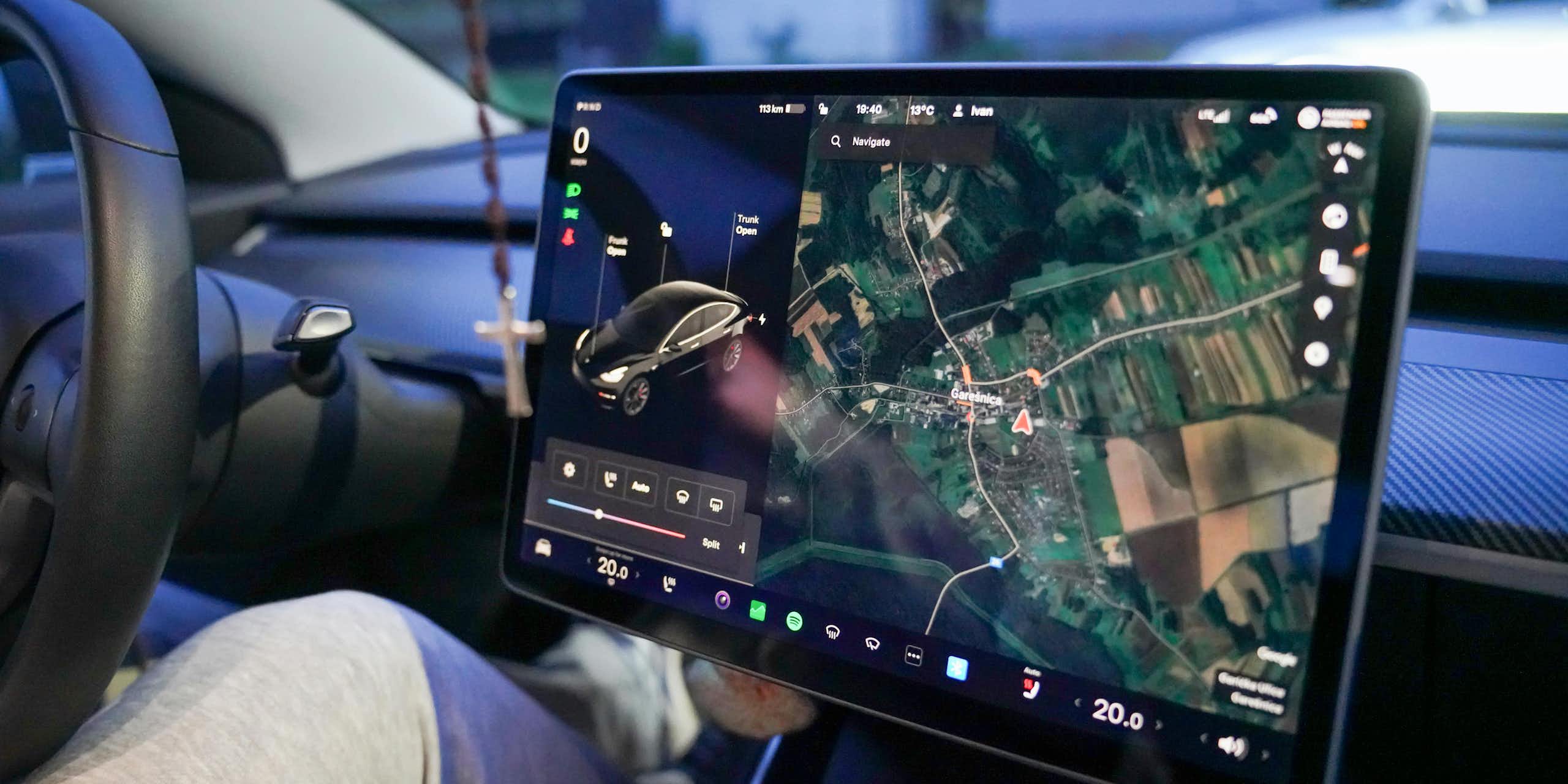 A giant touchscreen showing navigation and car controls.