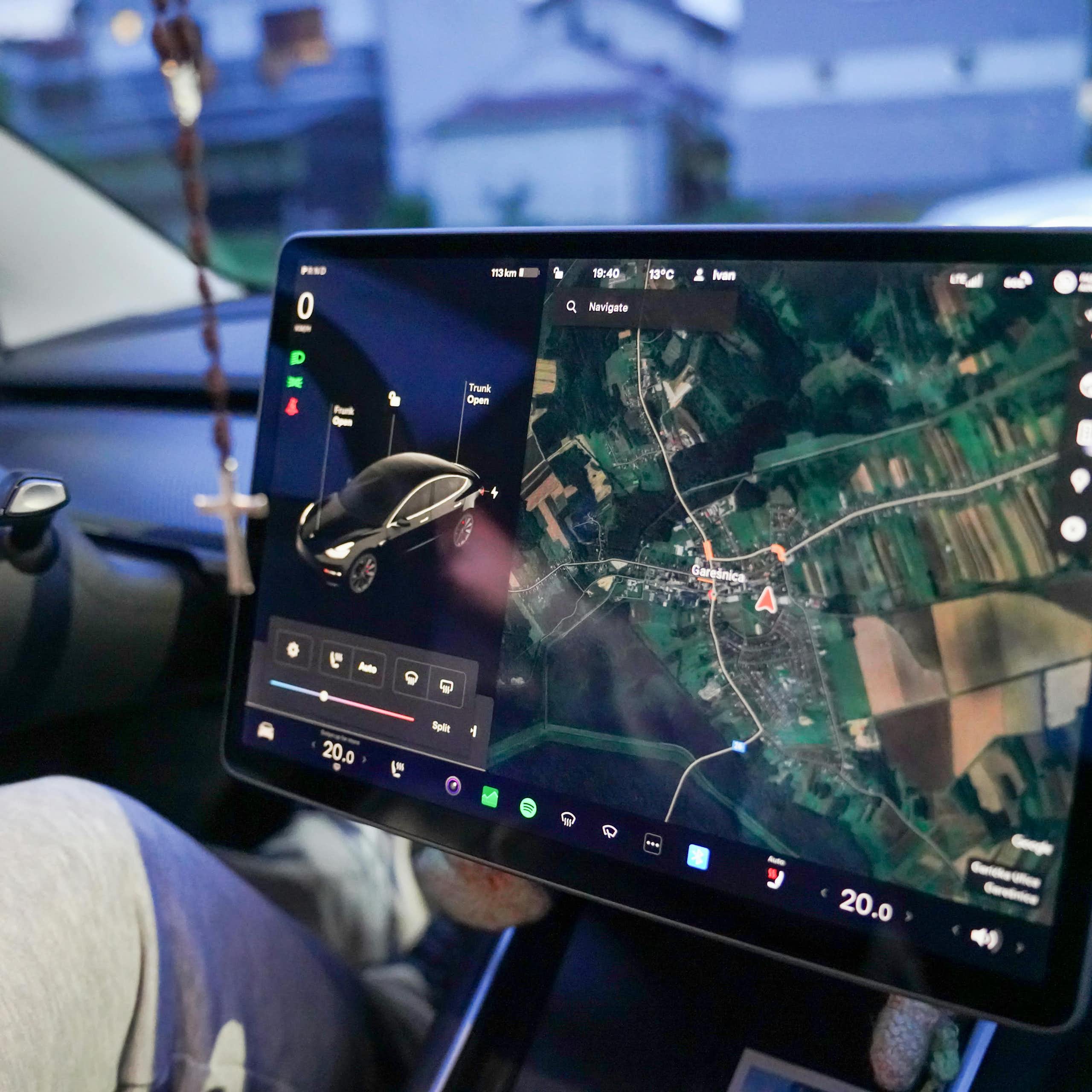 A giant touchscreen showing navigation and car controls.