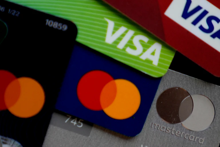 A stack of Visa and Mastercard credit cards