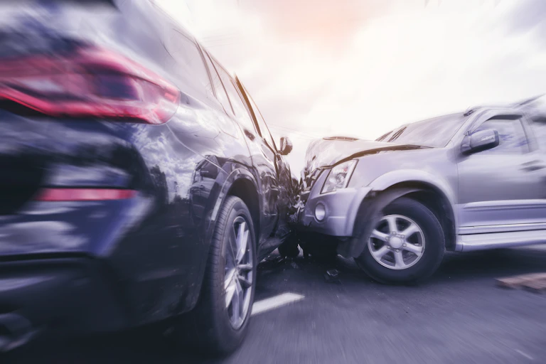 Photo illustration of two cars colliding