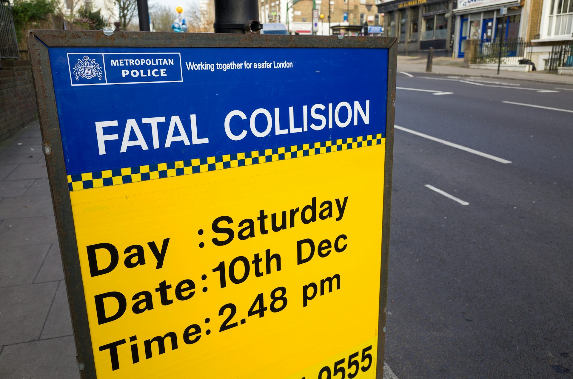 A road sign referring to a fatal collision in London