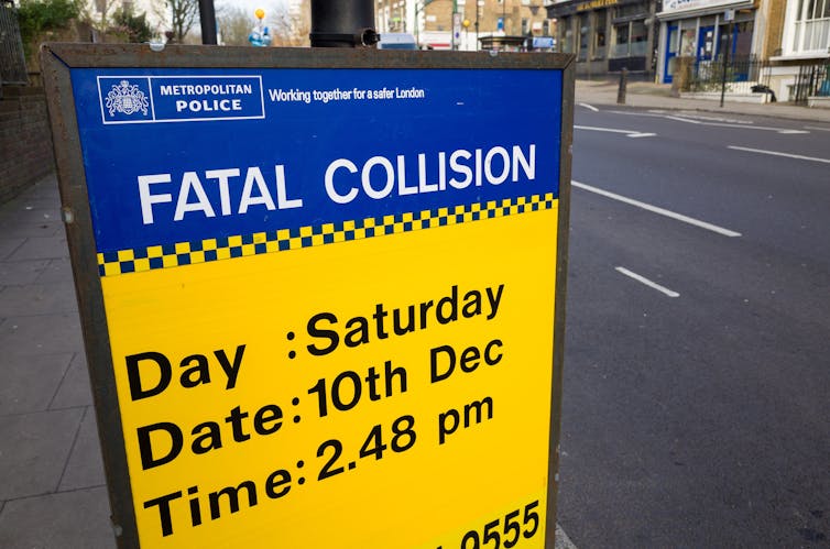 A road sign referring to a fatal collision in London