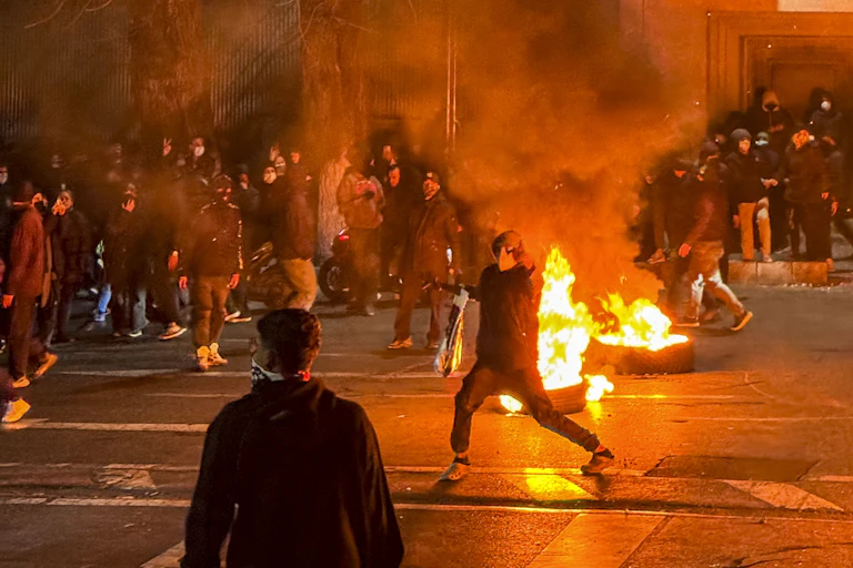 Iranian protesters block a street in Tehran on January 9.