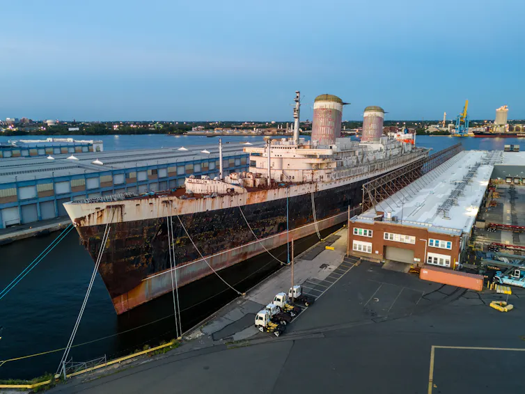 Large old ocean liner in dock