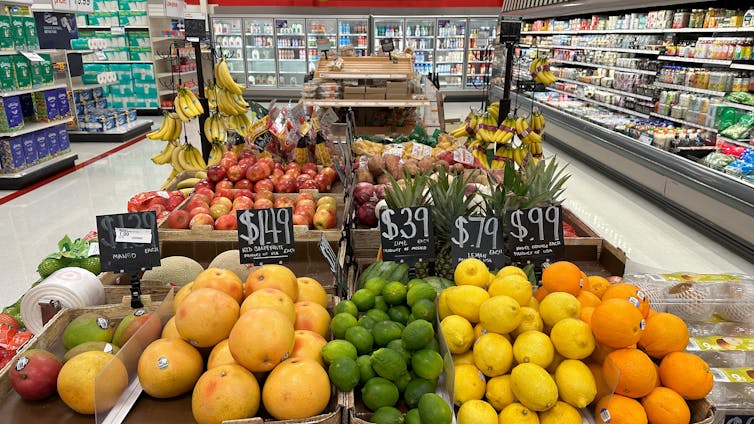 fruit and vegetables with price labels in a us supermarket