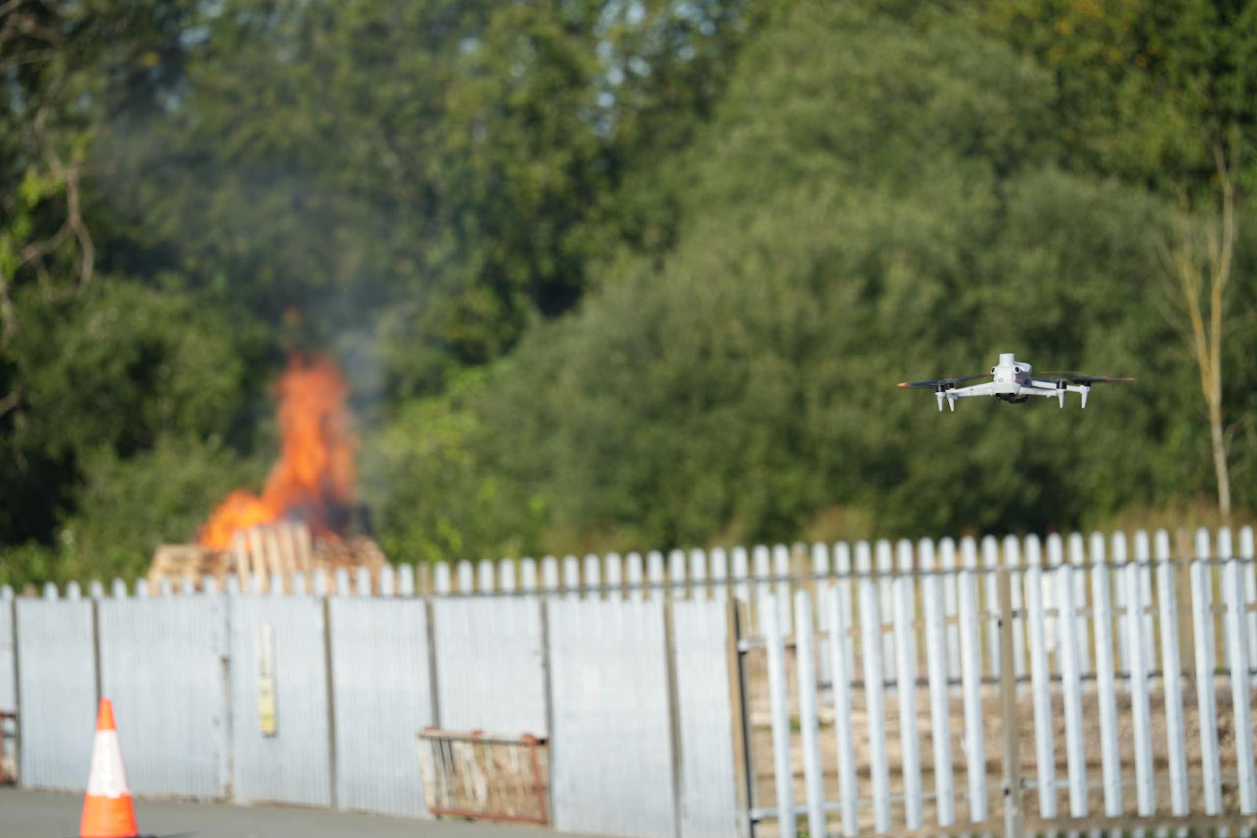 A drone approaches a test fire.