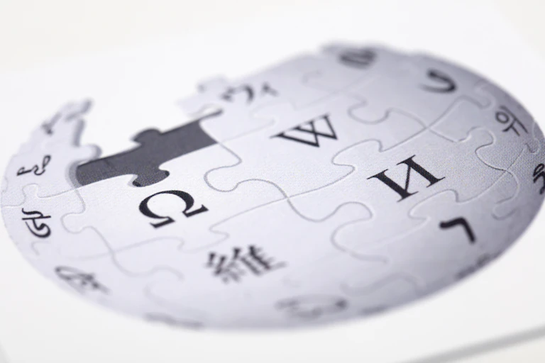 Wikipedia's white 'jigsaw globe' logo up close.