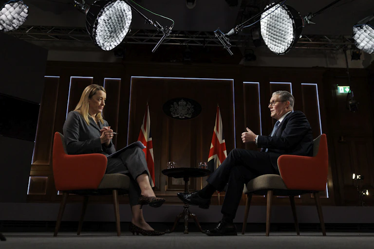 Keir Starmer and Laura Kuenssberg sitting face-to-face in a TV studio.