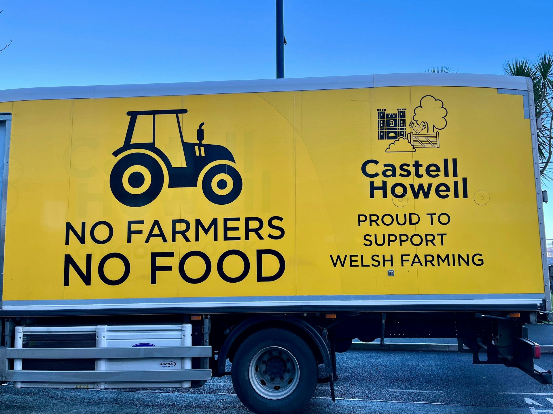 A lorry carrying a slogan about a Welsh farmers protest parked in Swansea, Wales.
