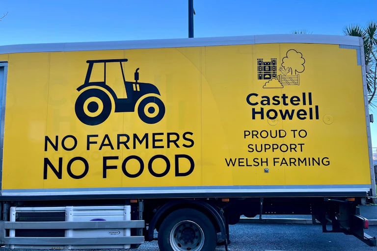 A lorry carrying a slogan about a Welsh farmers protest parked in Swansea, Wales.