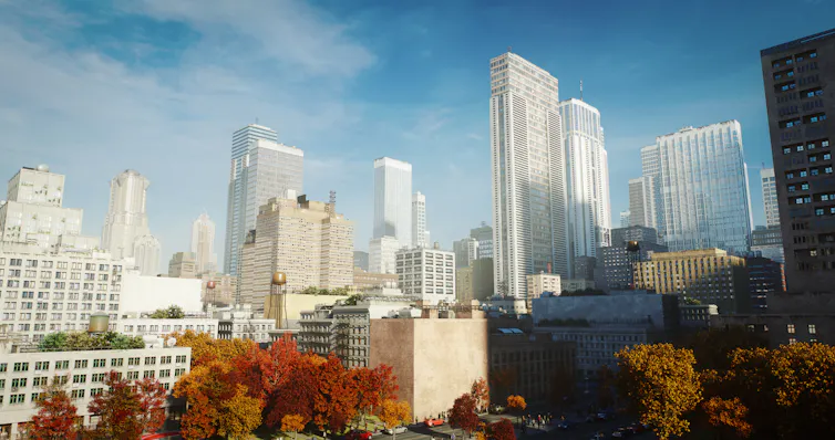 A cityscape of tall buildings on a fall morning.