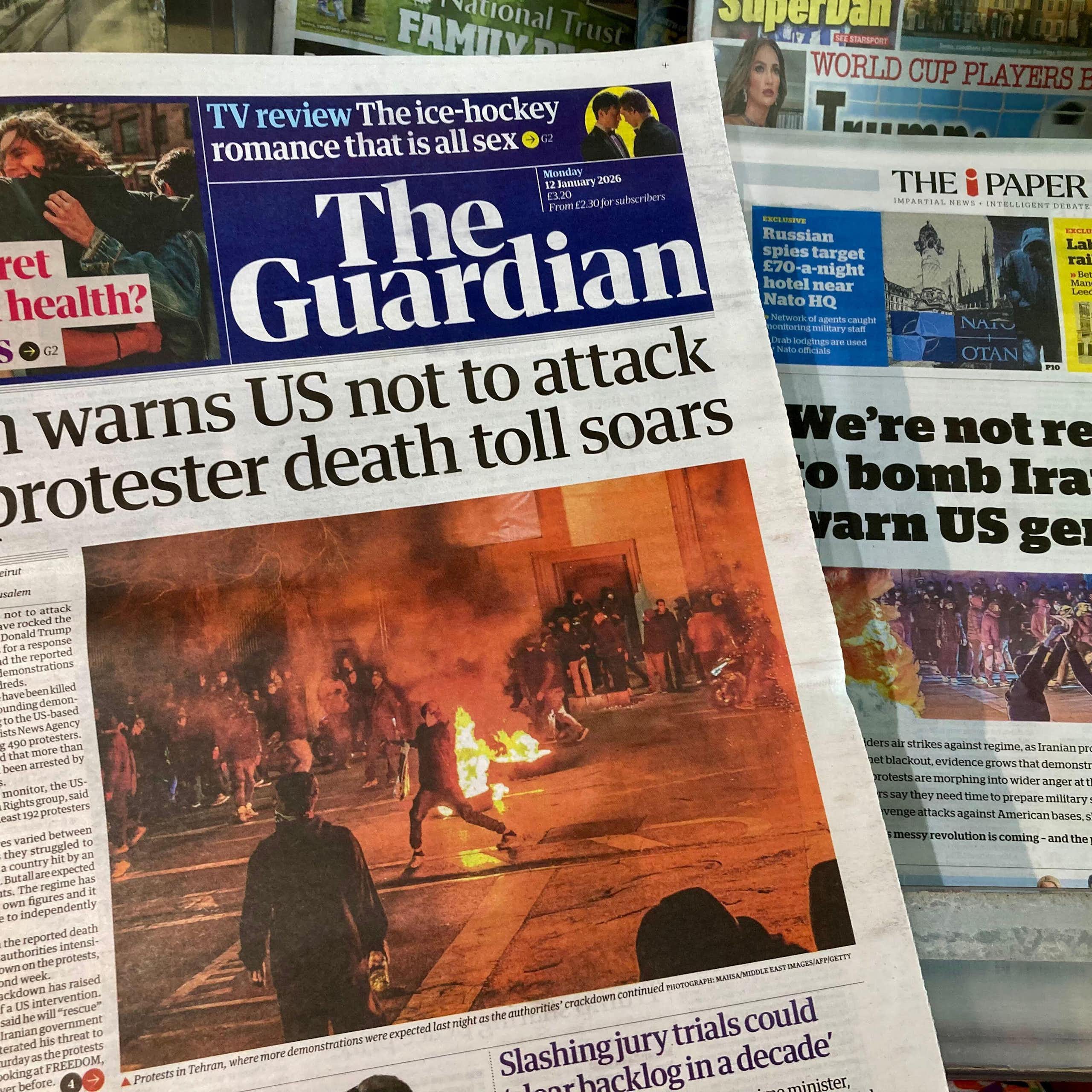 Front pages of the UK's Guardian and Independent newspapers dealing with the situation in Iran January 15 2026.