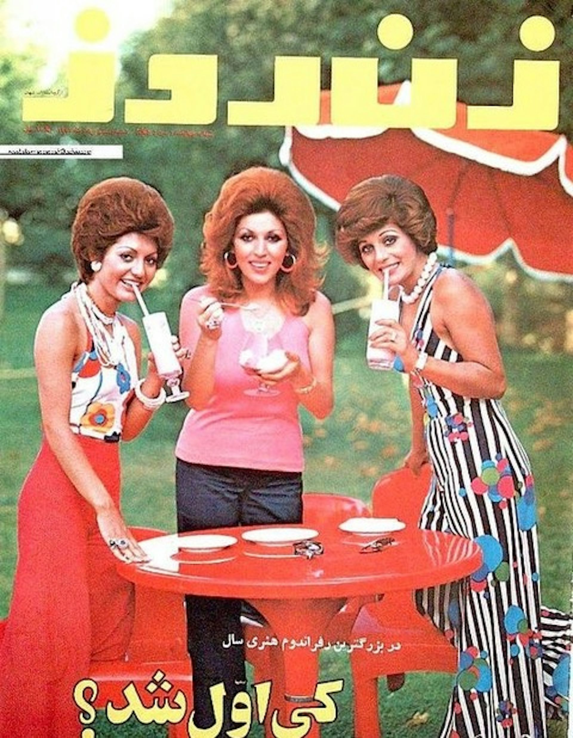A magazine cover featuring three young women wearing colorful, Western clothing and sipping drinks from straws.