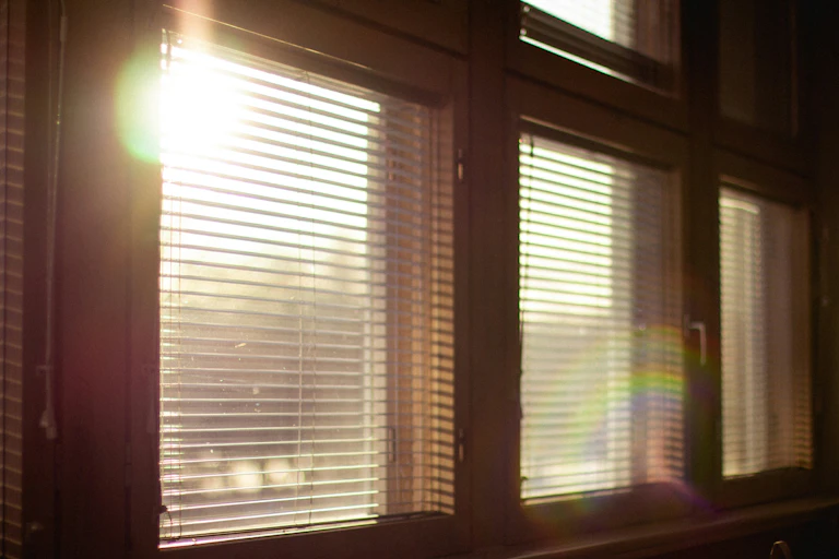 Sun shining through blinds.