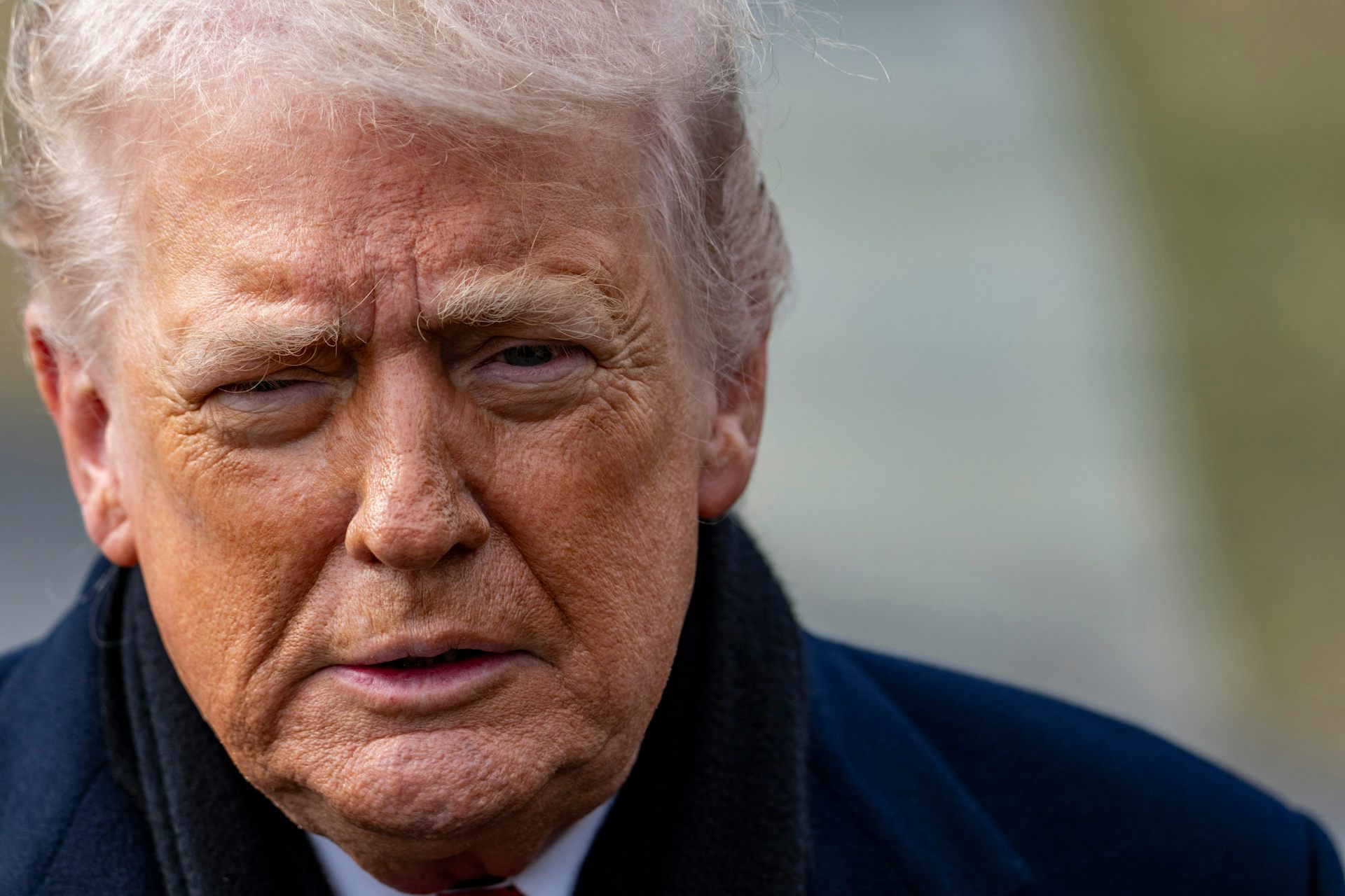 President Donald Trump speaks with reporters.