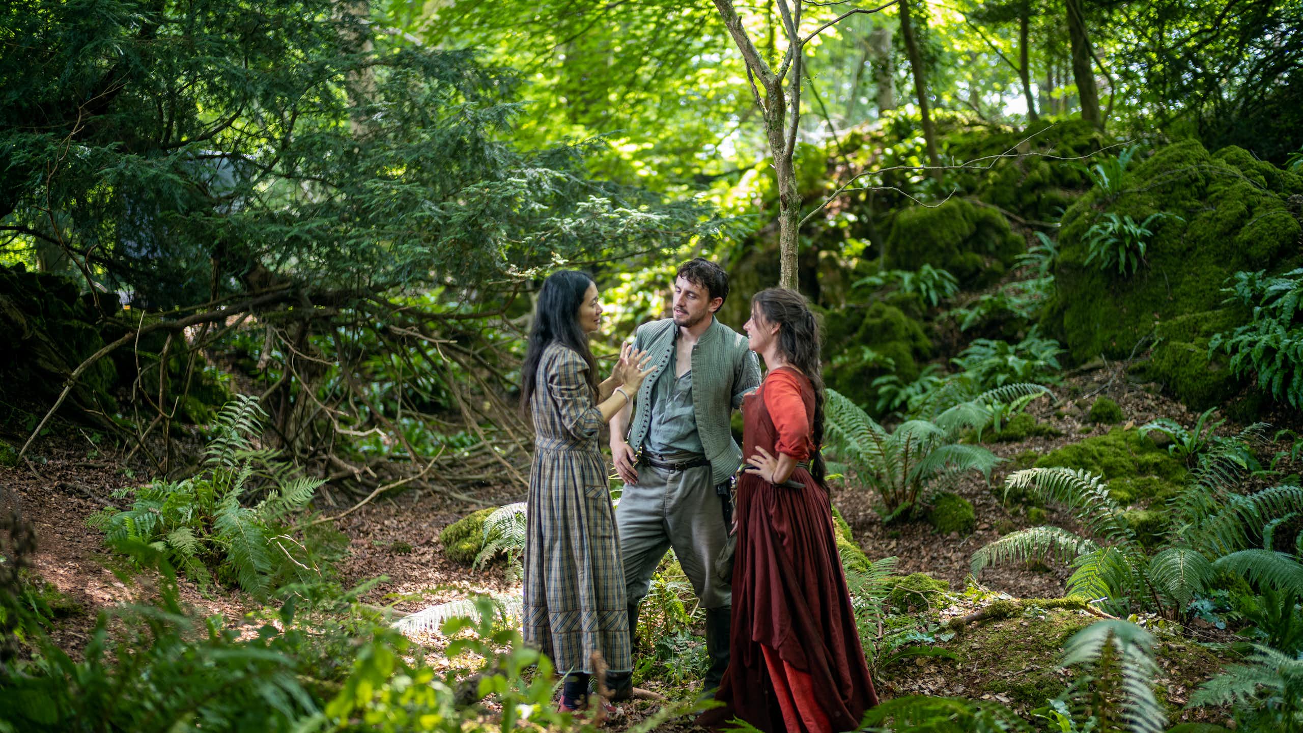 Director Chloé Zhao with actors Paul Mescal and Jessie Buckley on the set of Hamnet