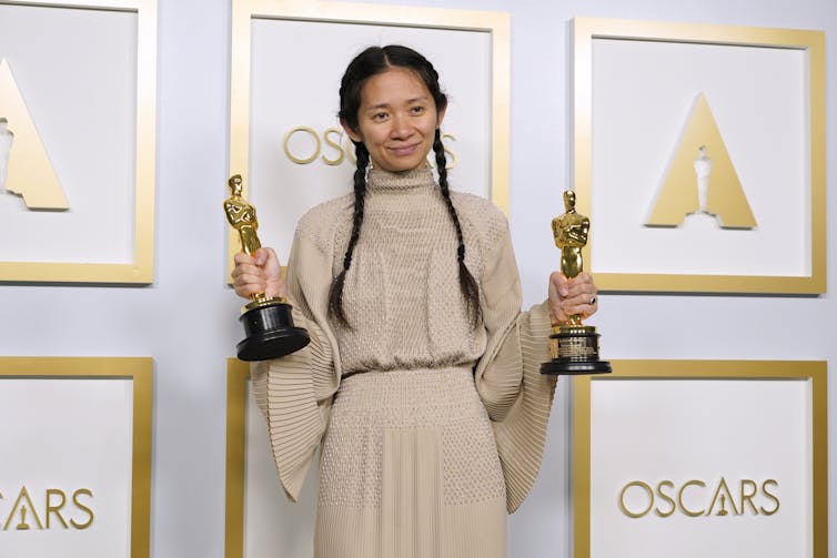 Zhao with her two Oscars.