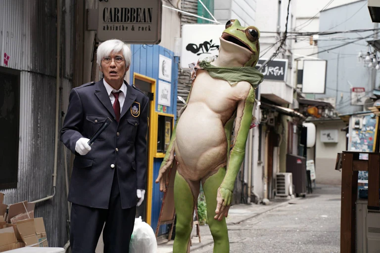 A man and a man-sized frog