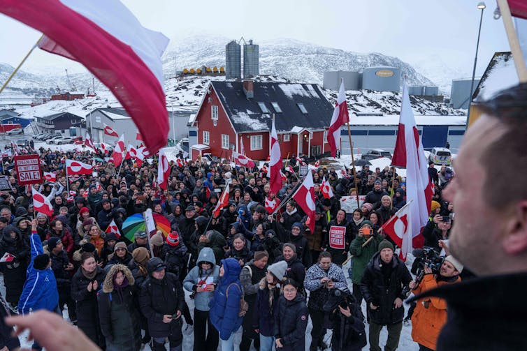 Crowd of people with Greenland flags