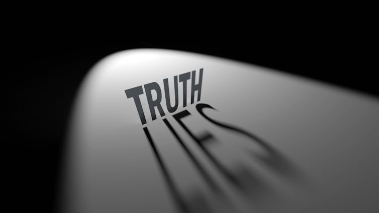 3D Illustration of shadowed words Truth and Lies