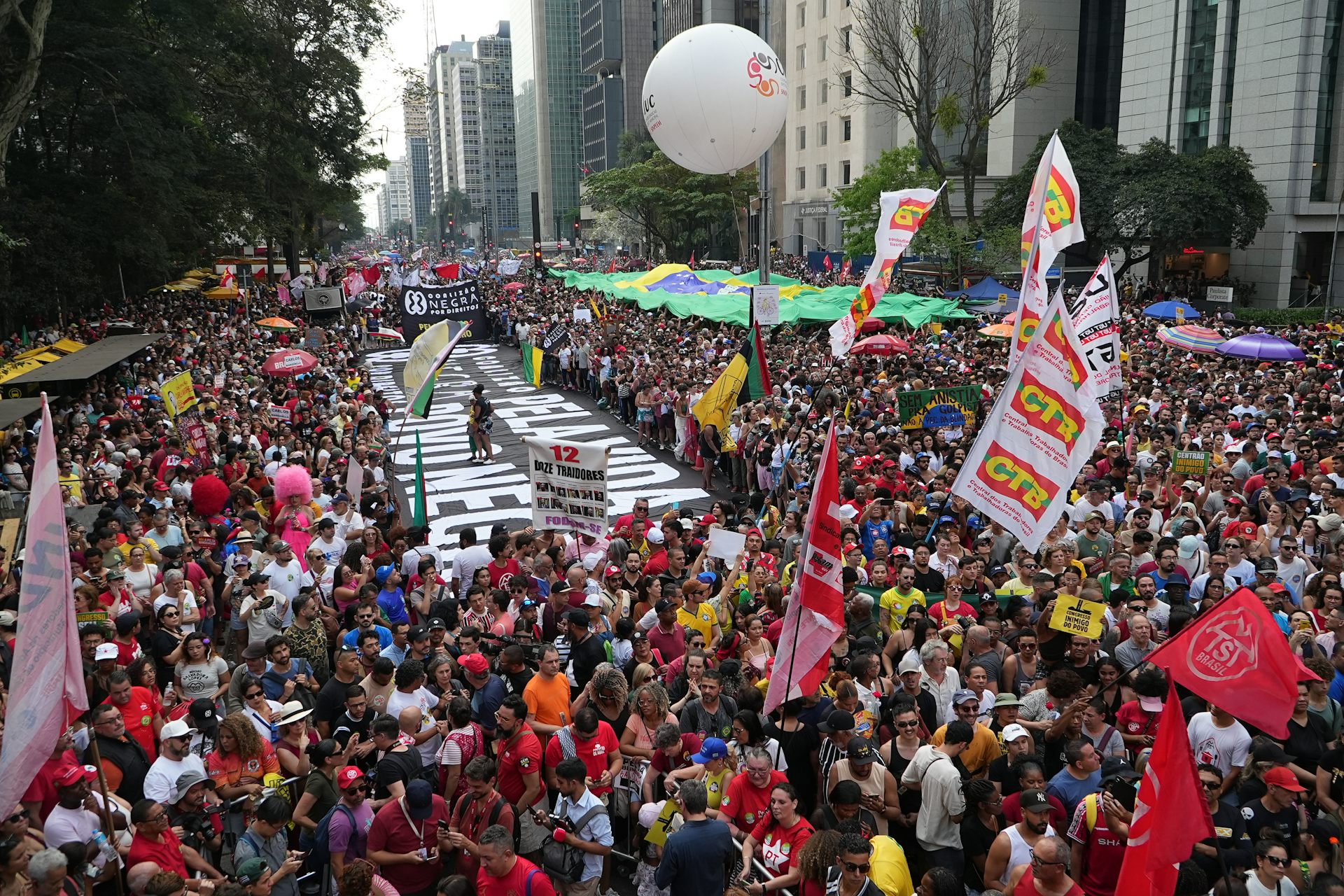 A massive crowd of people protest.