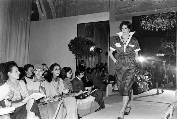 A woman in a polka-dot dress.