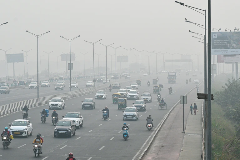 A busy road with smoggy air.