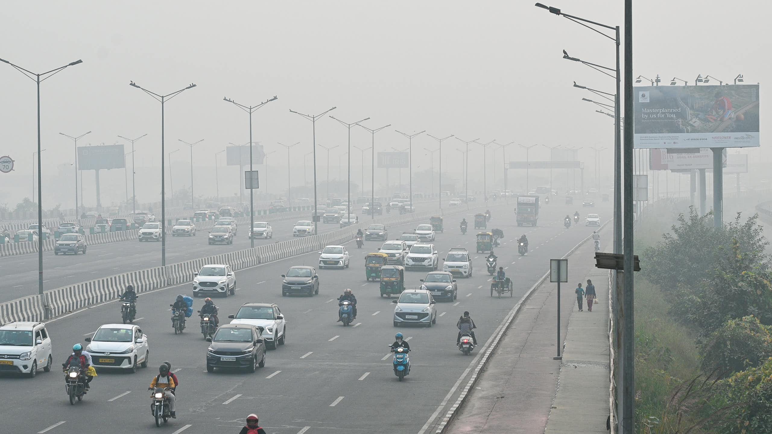 A busy road with smoggy air.