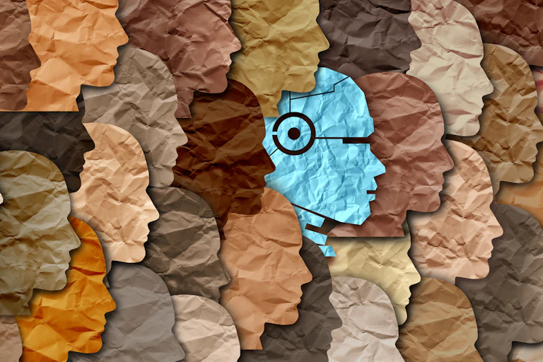 Collage of paper cut out faces, including one humanoid robot.