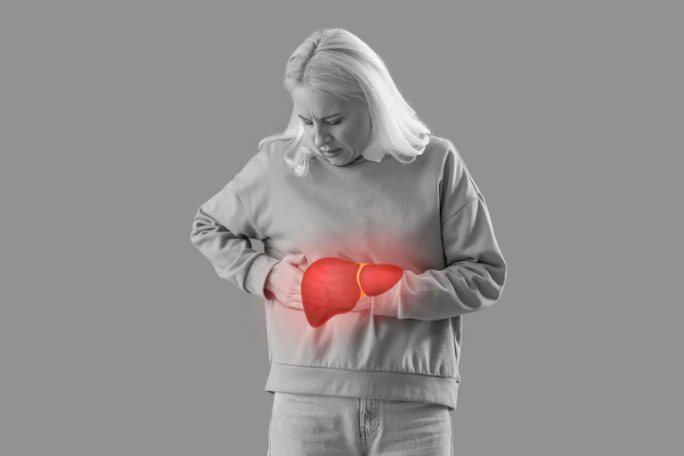 Mature woman feeling discomfort in liver on grey background