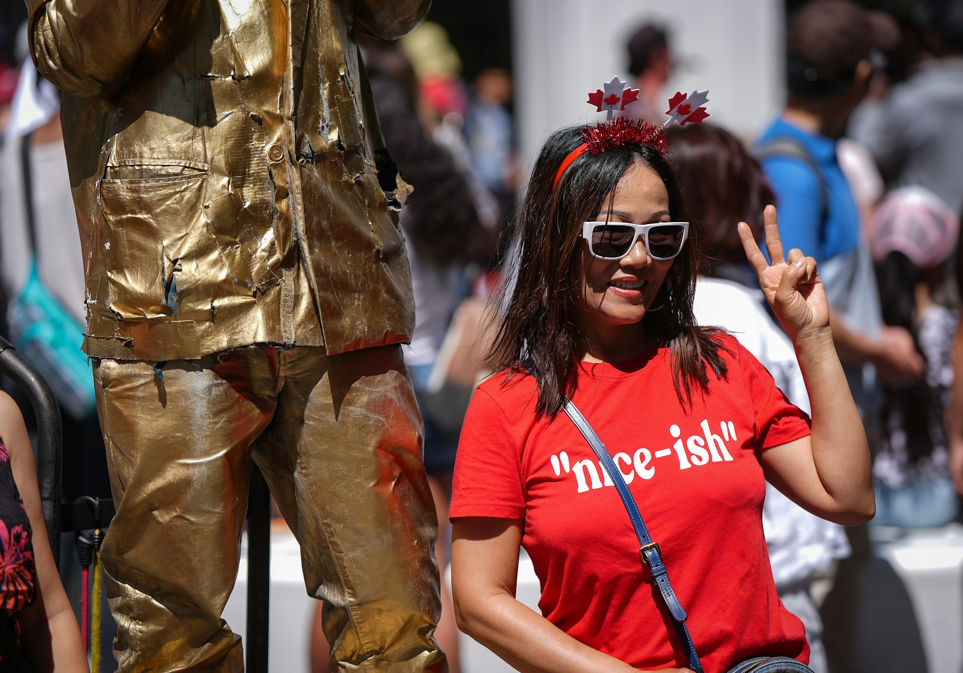 A woman in a red T-shirt that reads ‘nice-ish.’