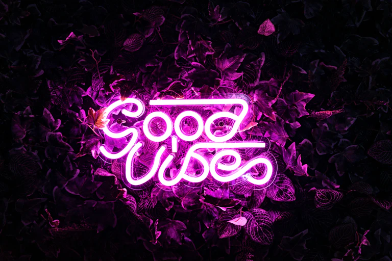 An electric neon sign that reads 'Good Vibes.'