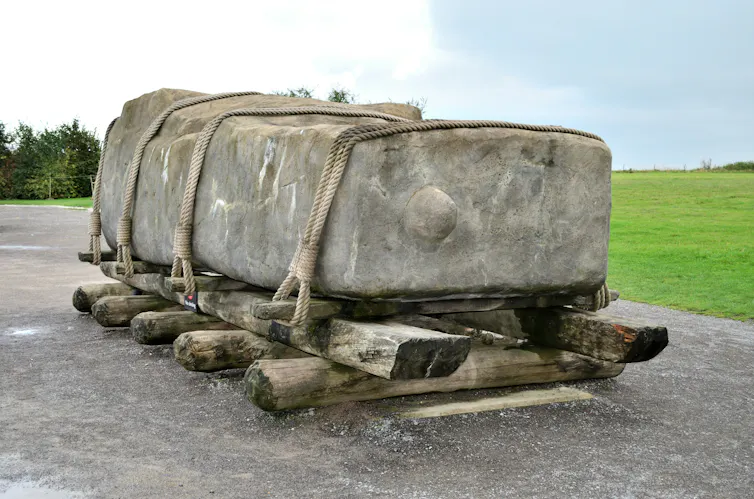 A large rock with ropes attached to it.