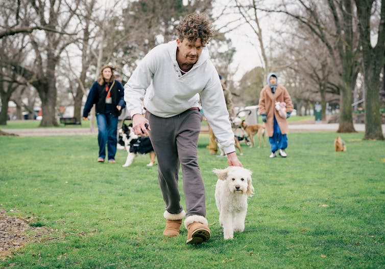 Production image: Roland runs in the park with Beattie.