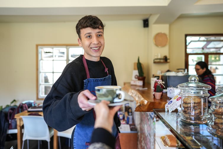 Young person working in a cafe